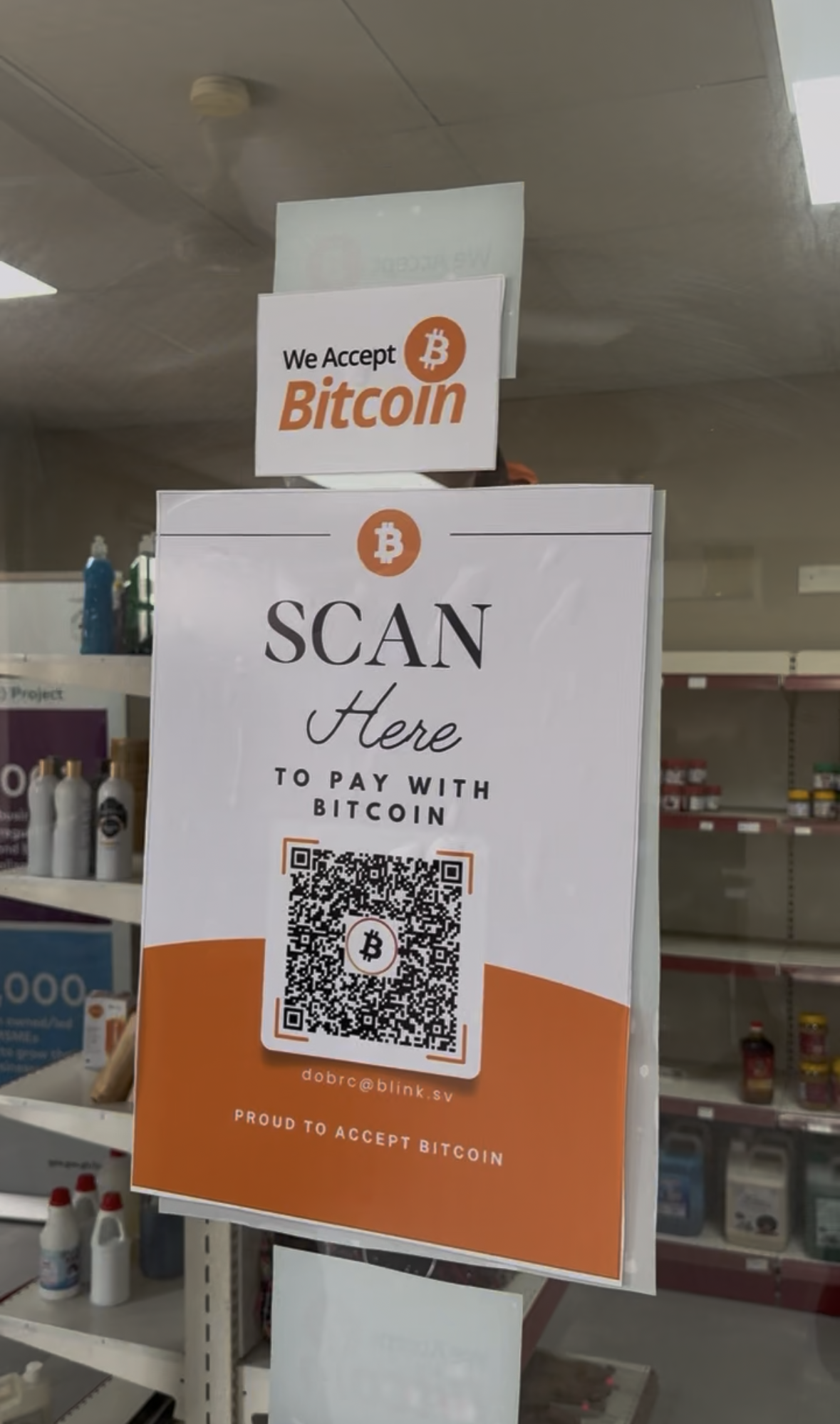 Bitcoin payment sign displayed at a local merchant location in Dodowa, Ghana.